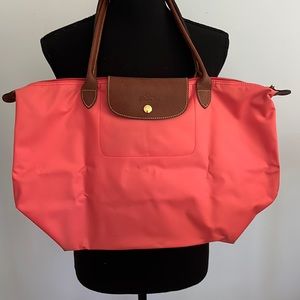 Longchamps Le Pilage bag. Coral and leather.